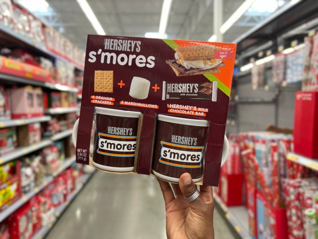 Hand holding a hershey s'mores gift set from the walmart gift aisle