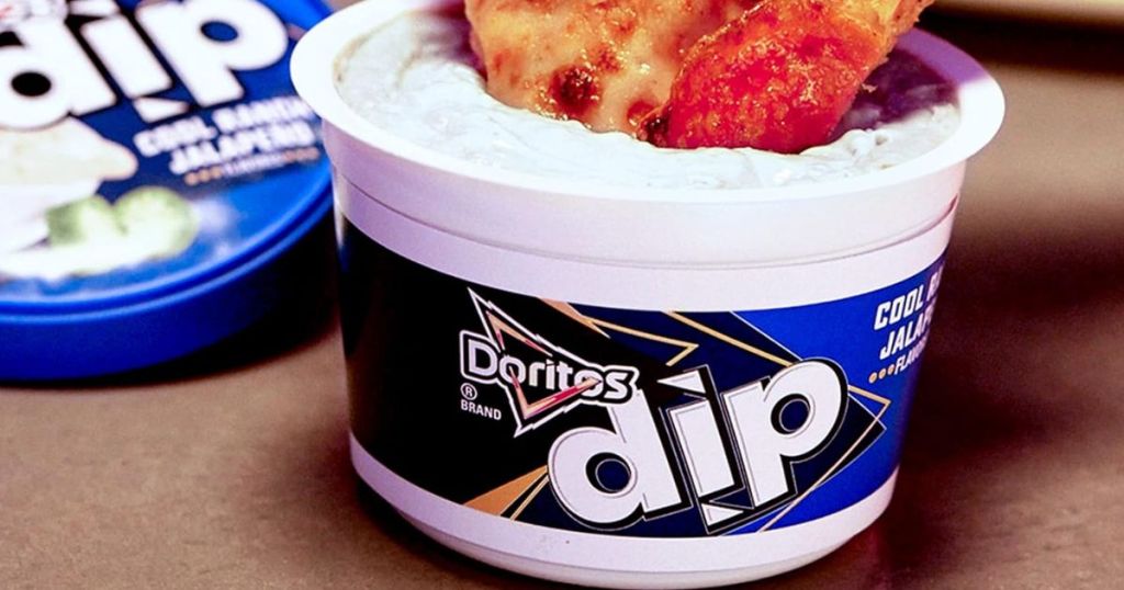 Doritos Cool Ranch Jalapeno Flavored Dip shown open with someone dipping pizza in it