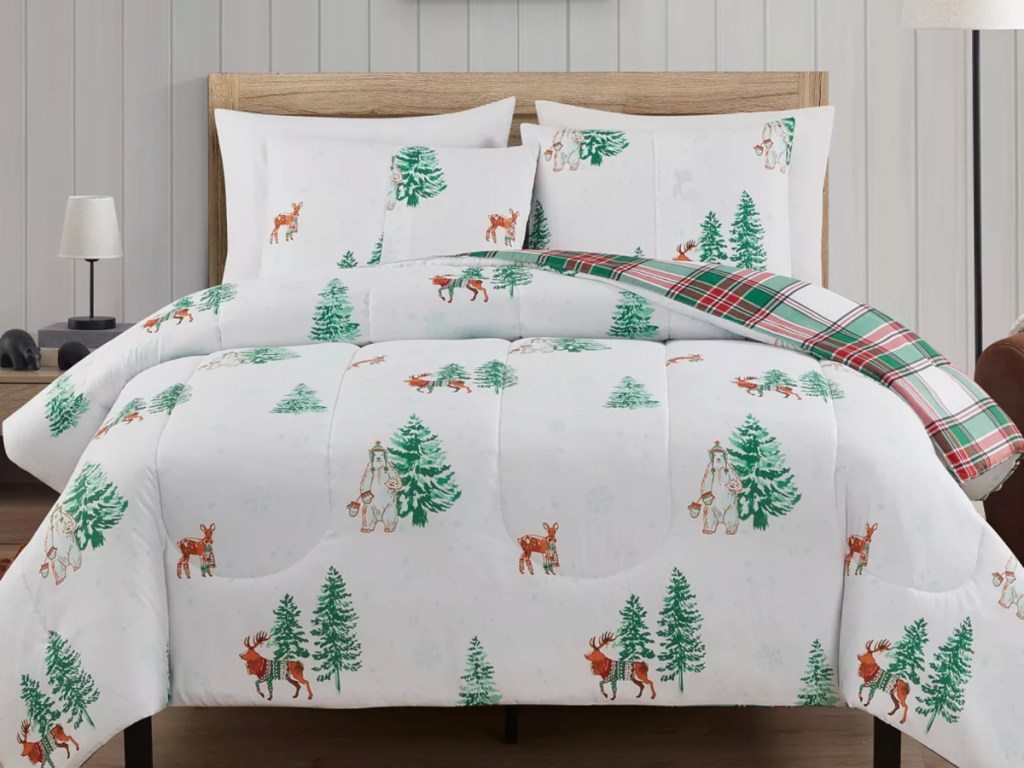 white holiday deer bedding on bed