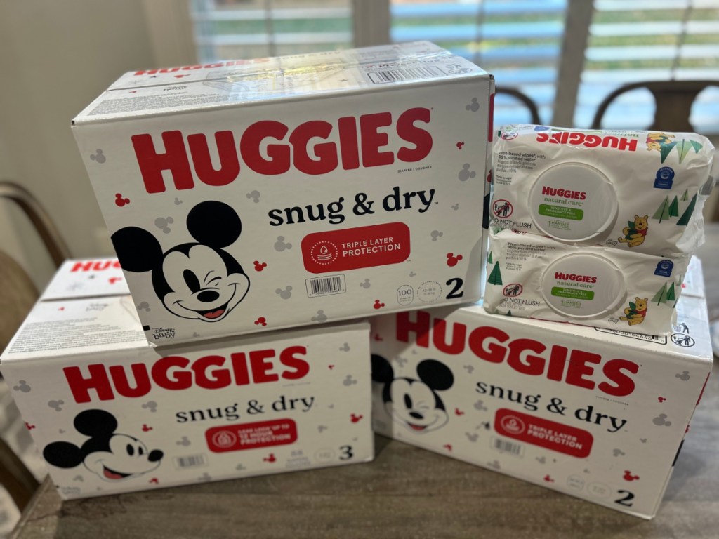 3 boxes of Huggies Diapers and 2 pack of Wipes