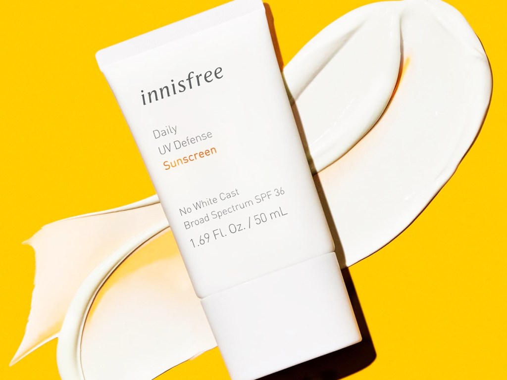 bottle of Innisfree Daily UV Defense Broad Spectrum Sunscreen on yellow background
