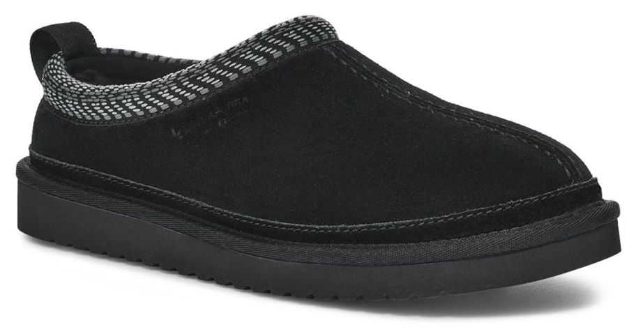 A person wearing a pair of Koolaburra by UGG Burree Women's Slippers in Black