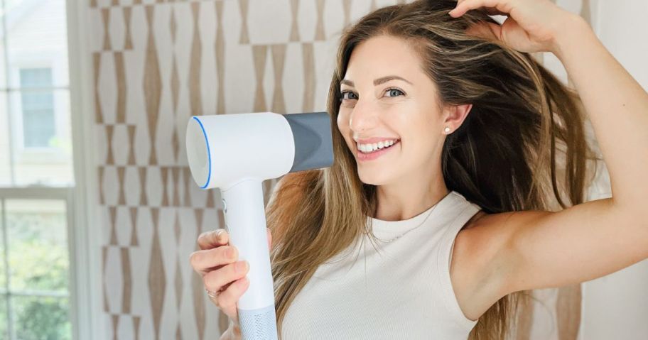 woman using ion hair dryer