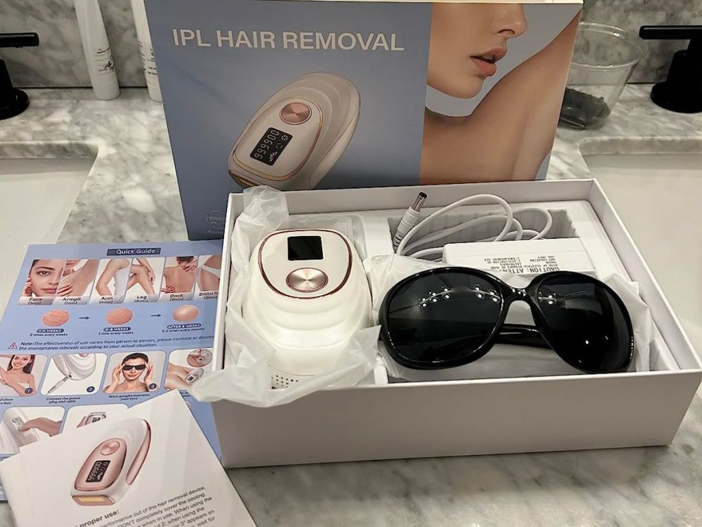 Lymoski IPL Device in box with sunglasses, razer and instructions
