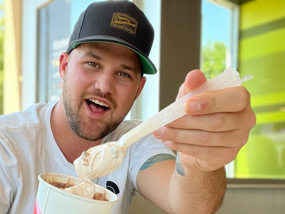 man holding a McFlurry spoon 