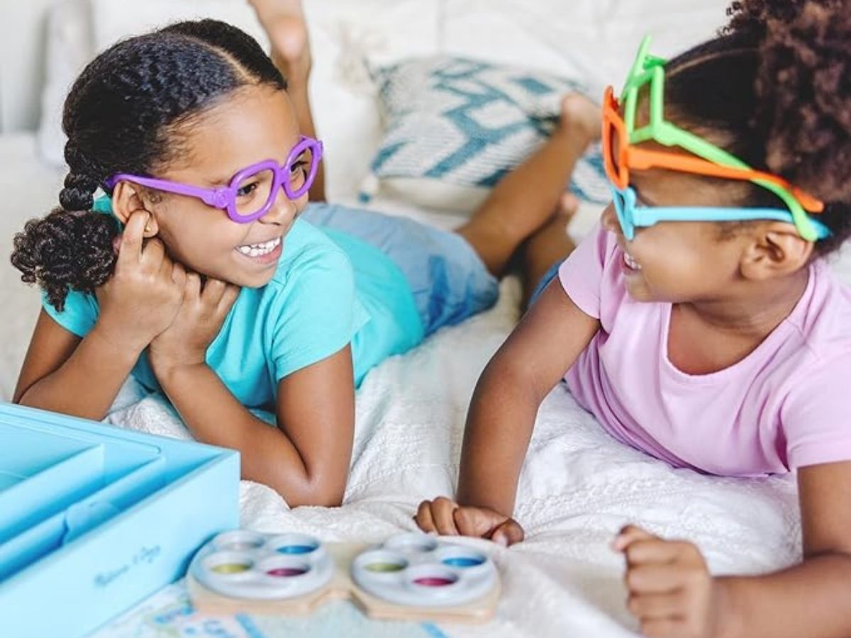2 girls playing with blues clues eye doctor set