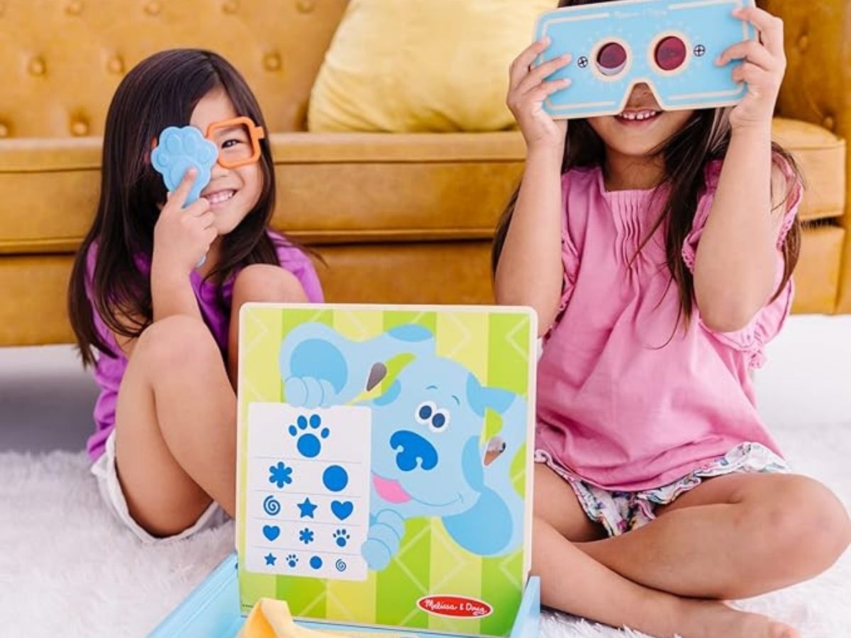 2 girls playing with blues clues eye doctor set
