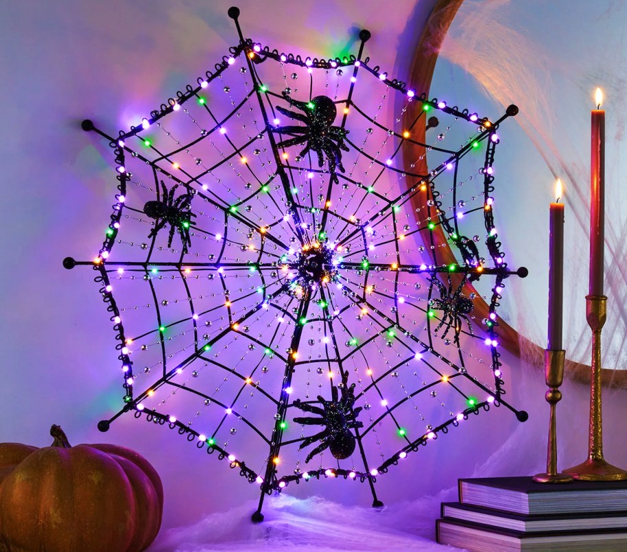 light up spiderweb decoration on mantel