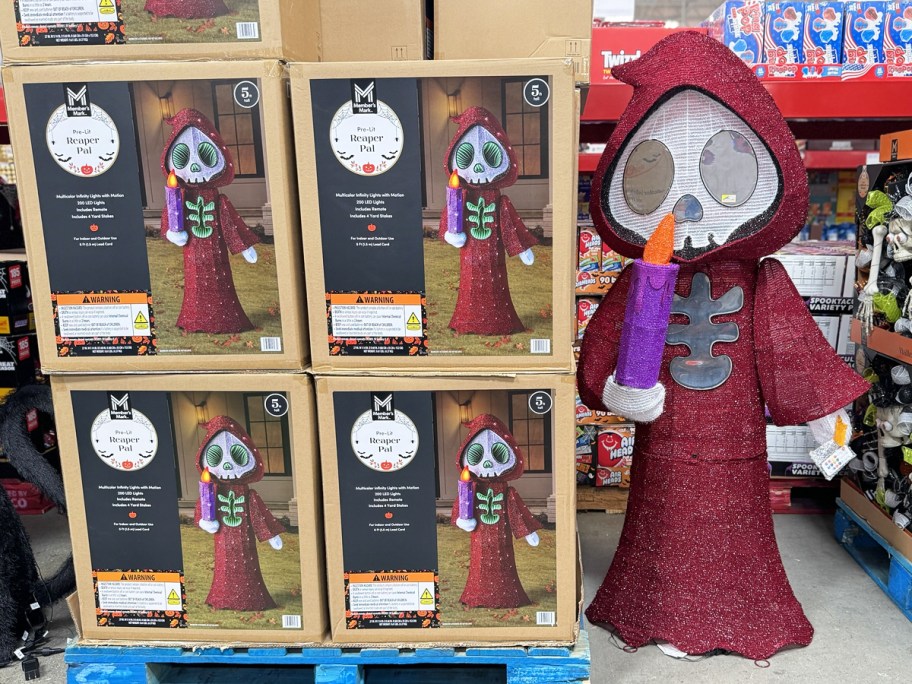 red reaper halloween decoration in display in store