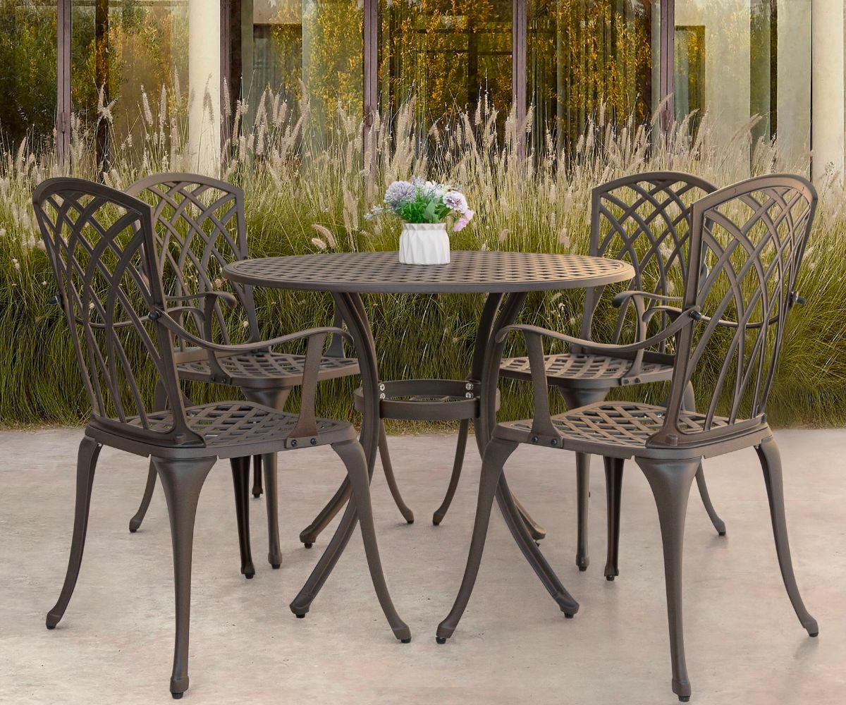 Nuu Garden 5-Piece Brown Patio Dining Set on a patio behind a house