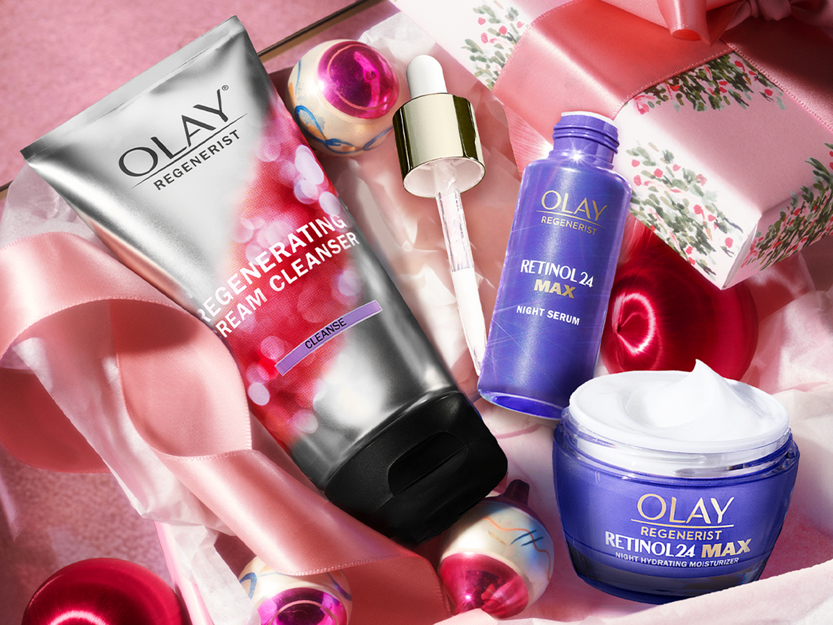 olay cleanser, serum, and moisturizer in a pink gift box
