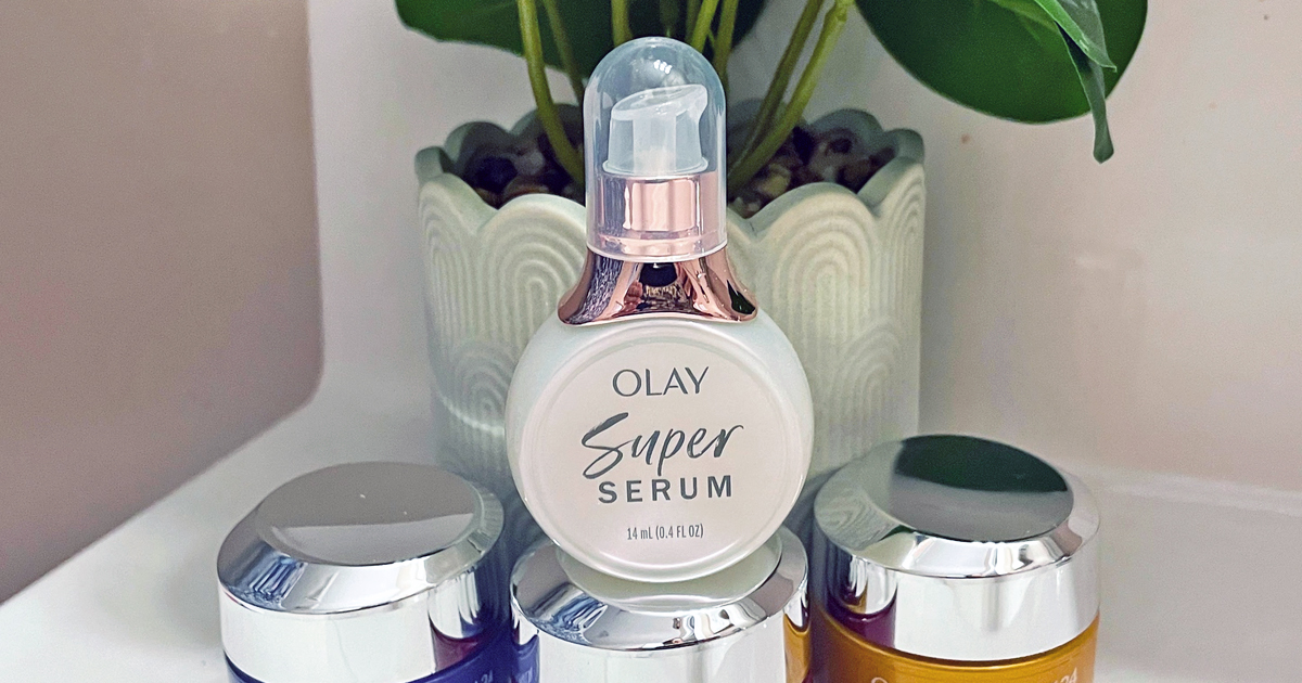 mini bottle of olay super serum in front of potted plant