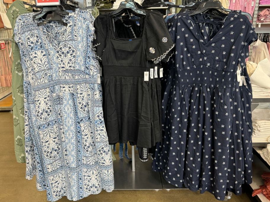 Old Navy women's dresses hanging on clothing racks at the store