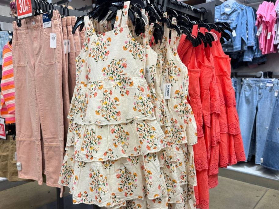 Old Navy Girls Tiered Eyelet Dresses hanging on a rack