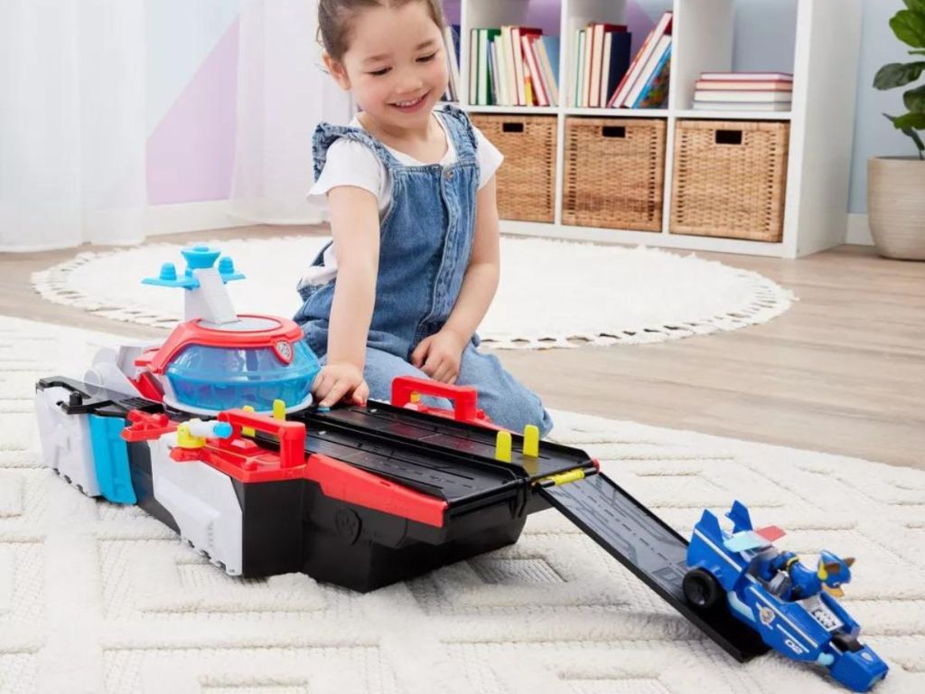 Little girl playing with the PAW Patrol Marine HQ Toy Vehicle Playset