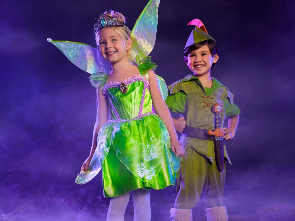 girl and boy wearing disney peter pan costumes