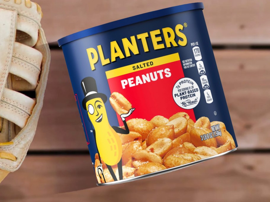 jar of peanuts next to baseball gloves