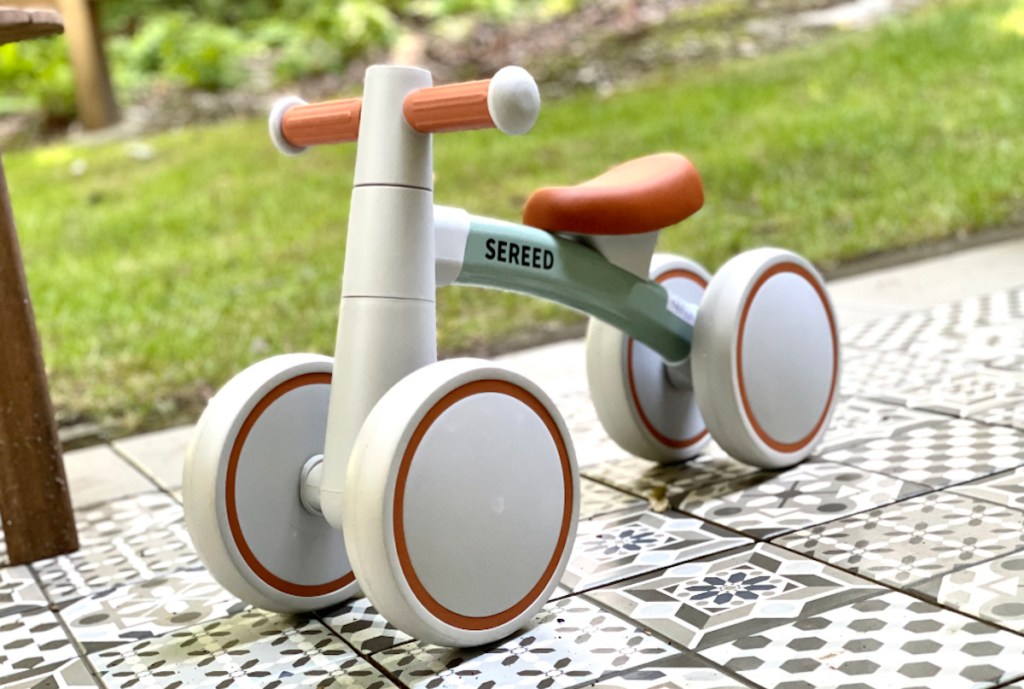 close up of SEREED Baby Balance Bike on outdoor tiles