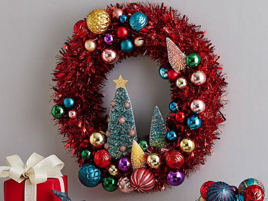 A Member's Mark Tinsel Wreath hanging on a wall