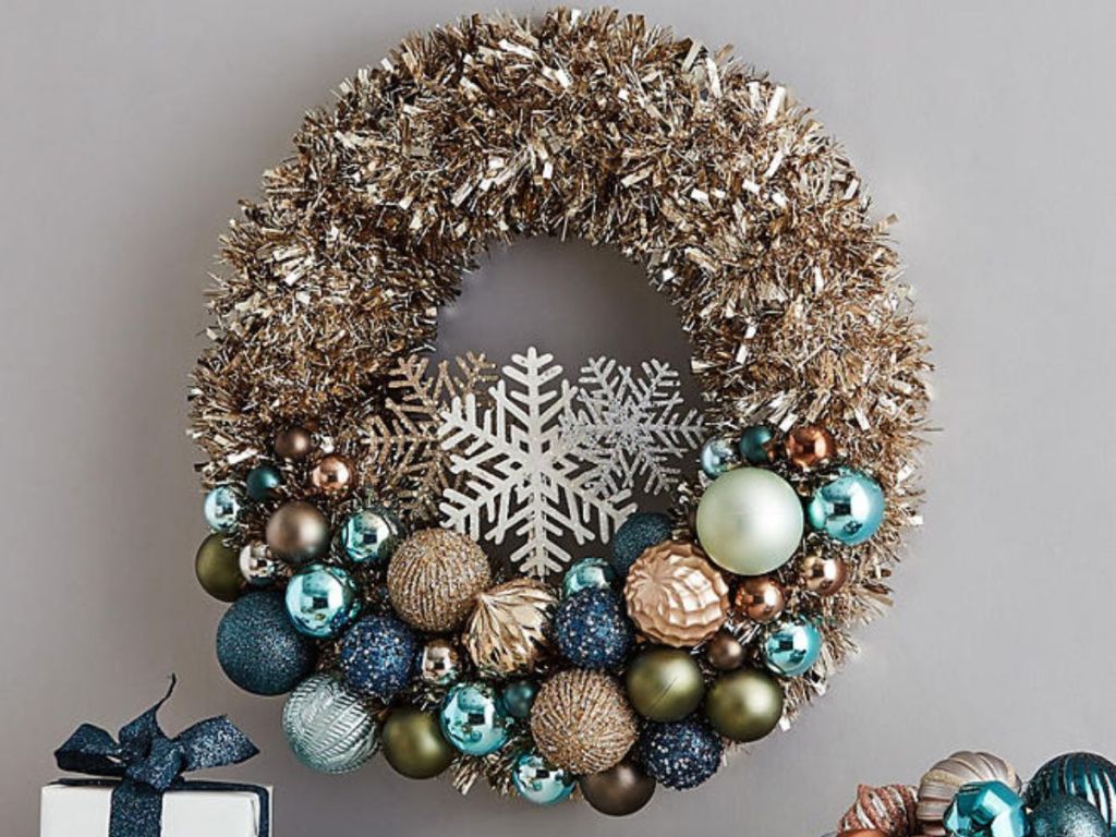 A Member's Mark Tinsel Wreath hanging on a wall