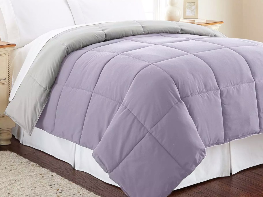 purple and grey comforter on bed