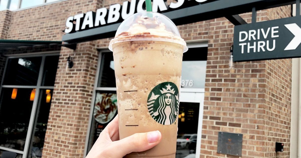 Hand holding up a Starbucks frappuccino