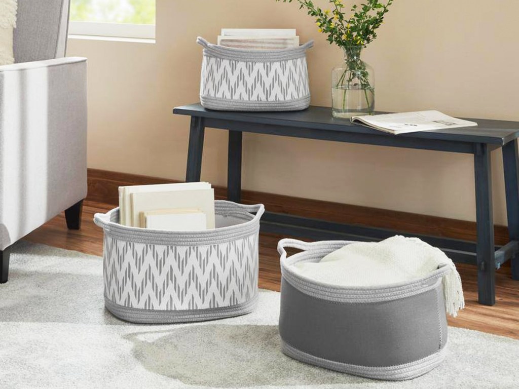 grey cotton rope baskets on floor and wood bench