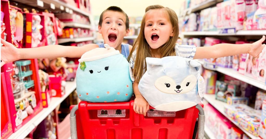 Toy very excited kids in a Target shopping cart with Squishmallows