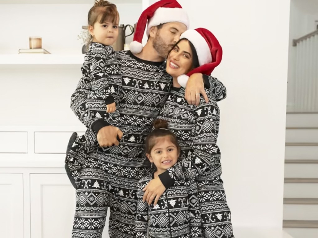 family in matching black and white fairisle print pajamas