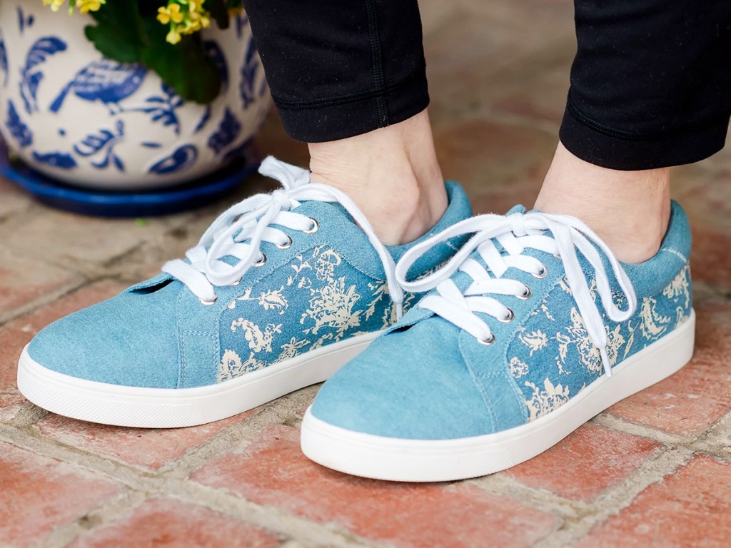 woman in blue and white sneakers