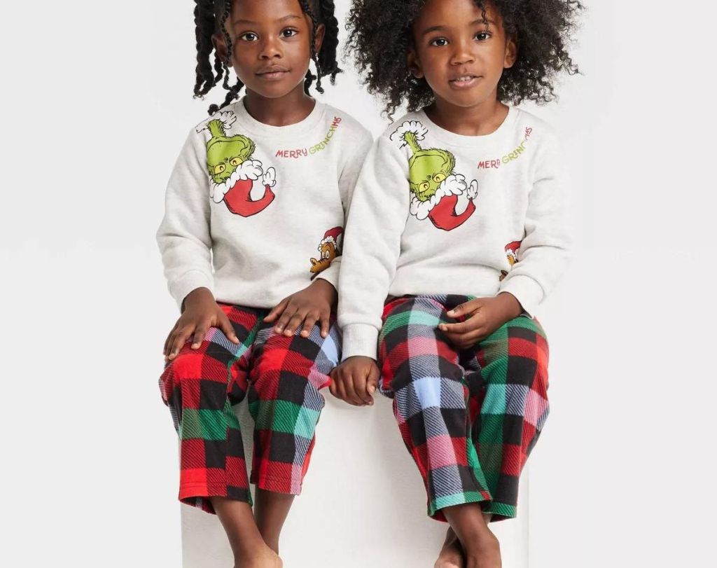 2 little girls with Toddler The Grinch Printed Pullover Sweatshirts