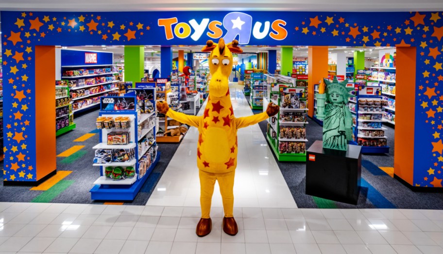 The Toys R Us Mascot standing outside a storefront