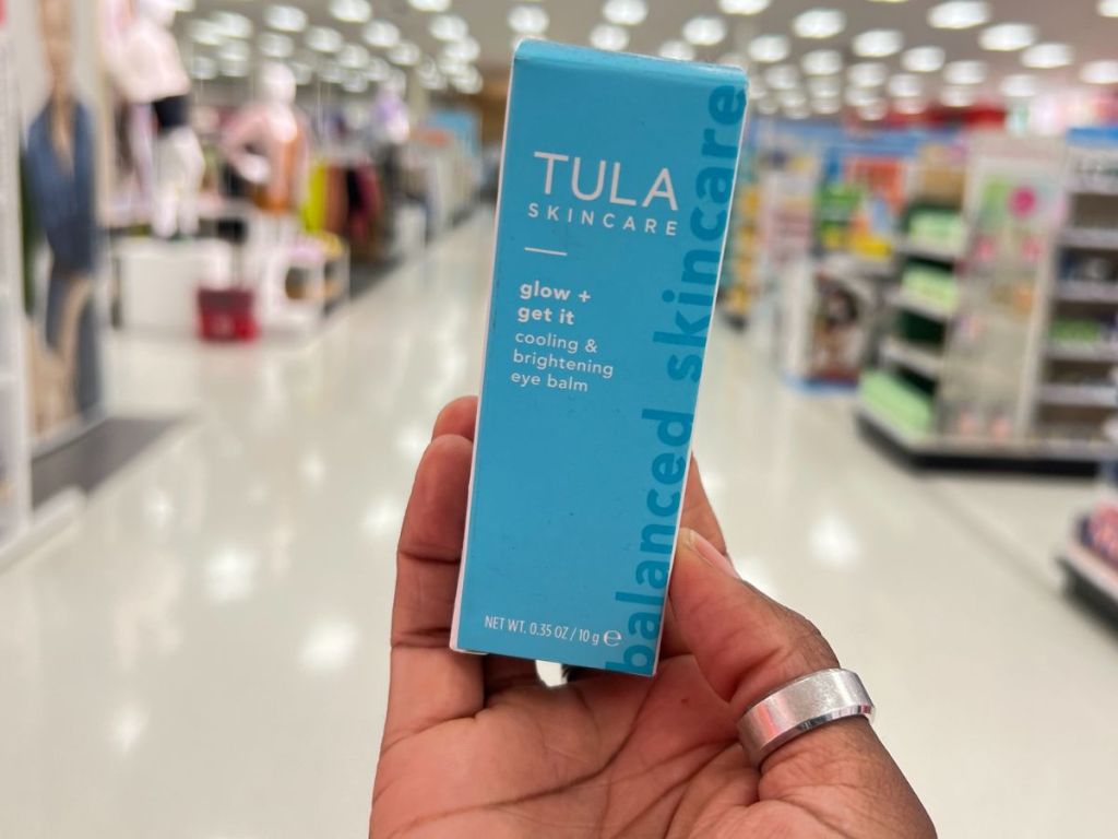 A hand holding Tula Skincare Glow + Get It at Target