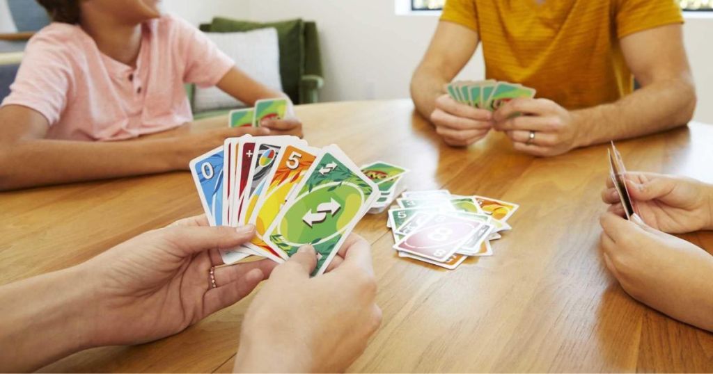 A family playing with UNO Paper with Family