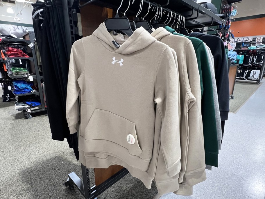 rack of under armour boys hoodies in store