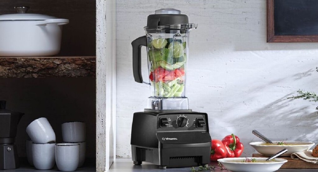 Vitamix 5200 Blender with food inside of it and displayed with food on the outside