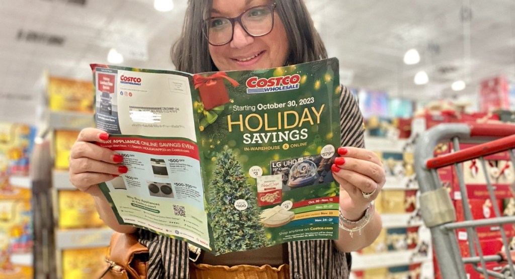 Woman reading the new Costco holiday booklet at the store