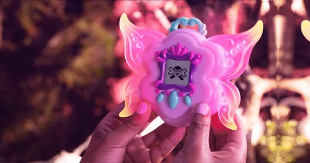 girls hands holding up the WowWee Got2Glow Baby Fairy Finder