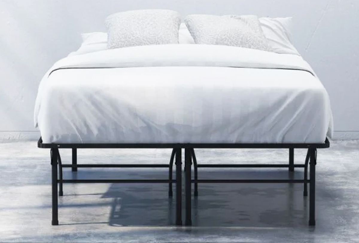 mattress on a black metal bed frame