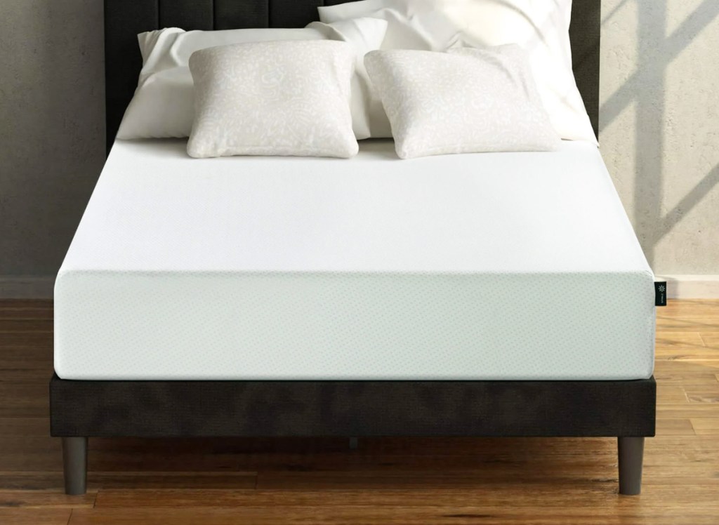 memory foam mattress on a black bed frame