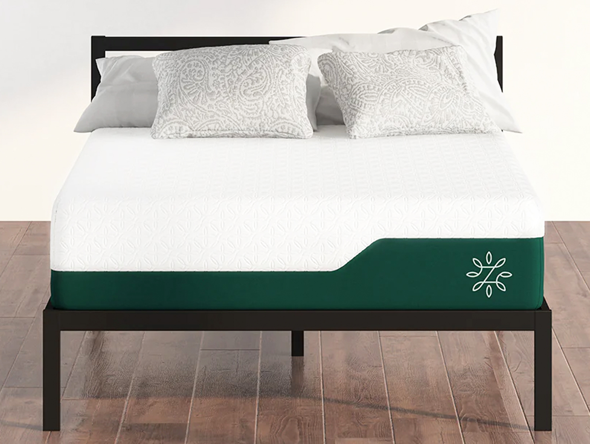 white and green mattress on a black metal bed frame