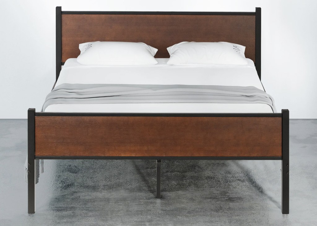 wood and black metal bed frame with matching head and footboards
