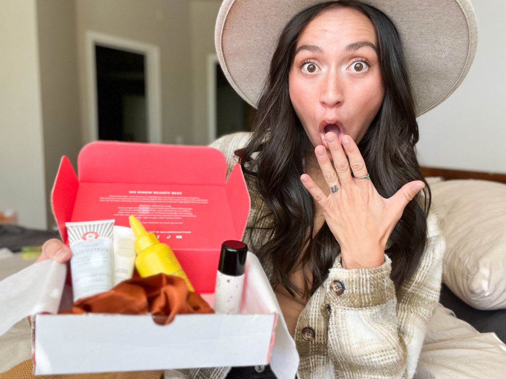 woman surprised with allure beauty box