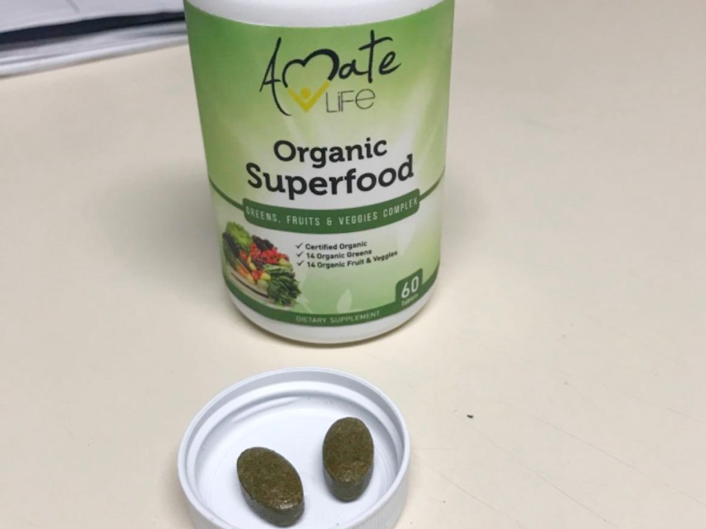 amate lief organic superfood bottle and pills in lid