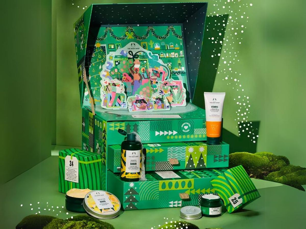 body shop ultimate advent of change 2023 advent calendar with top open and products arranged around it