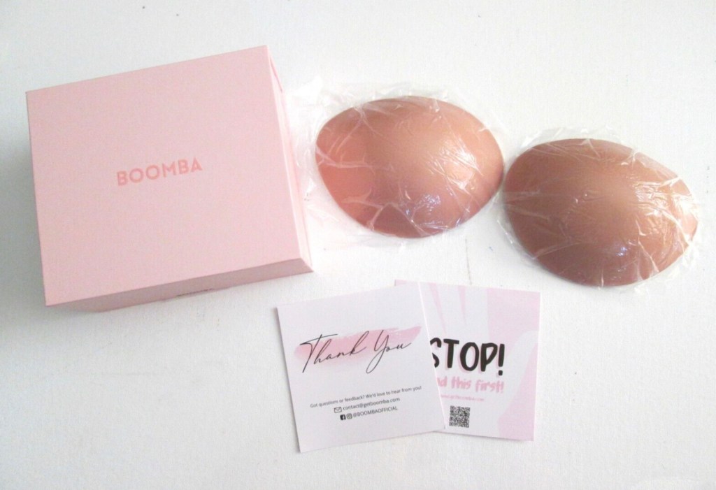 boomba breasts covers with pink box on white table