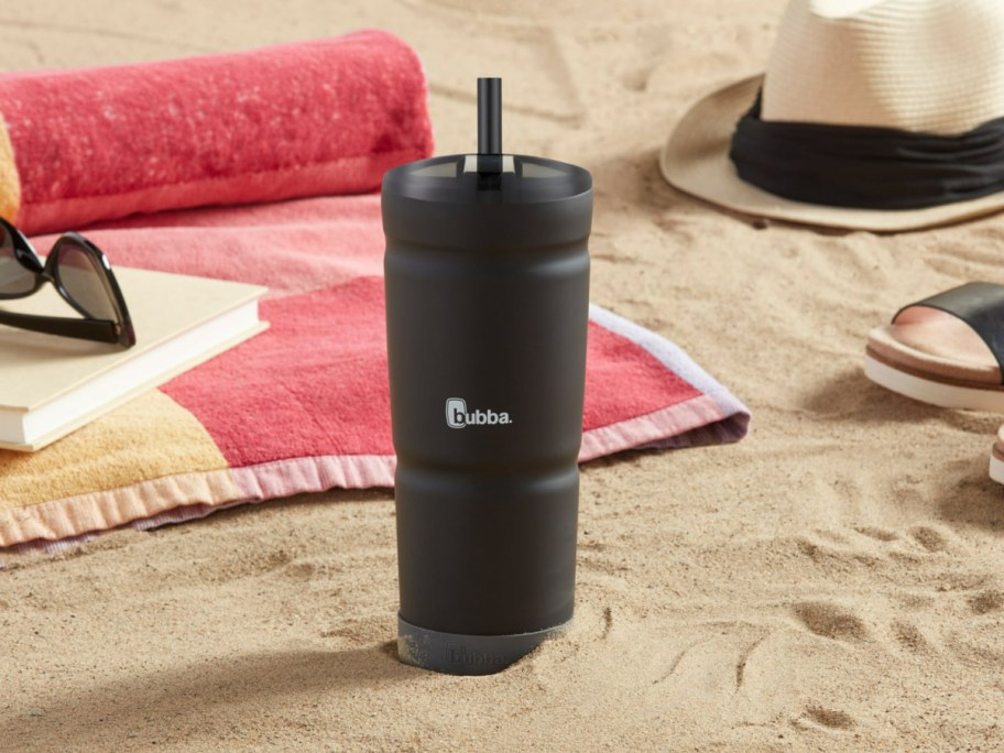 bubba tumbler with straw displayed on the beach