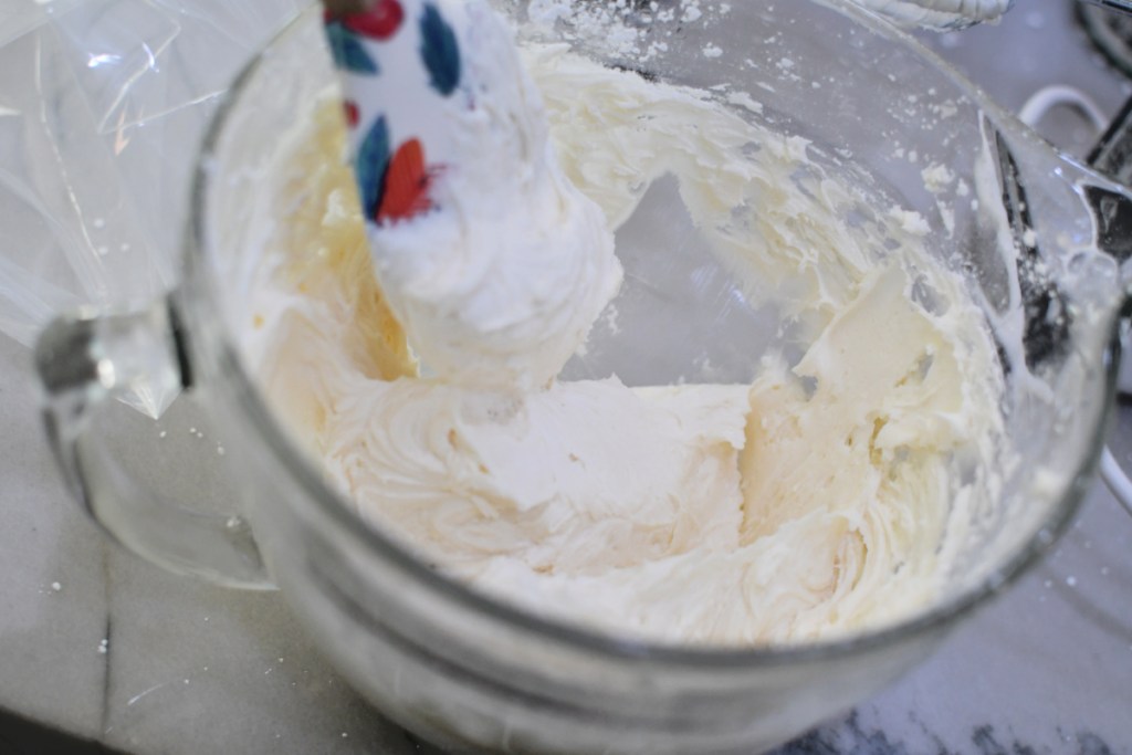 homemade buttercream frosting in a mixing bowl 