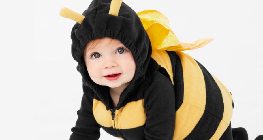 a baby in a black and yellow bee costume. 