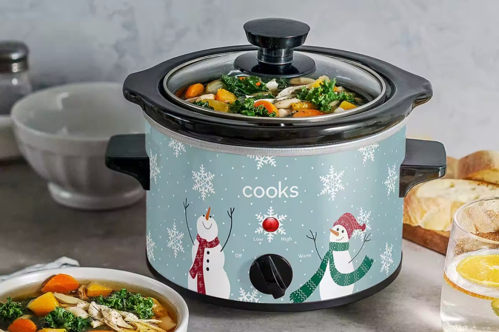 snowman slow cooker with food in it